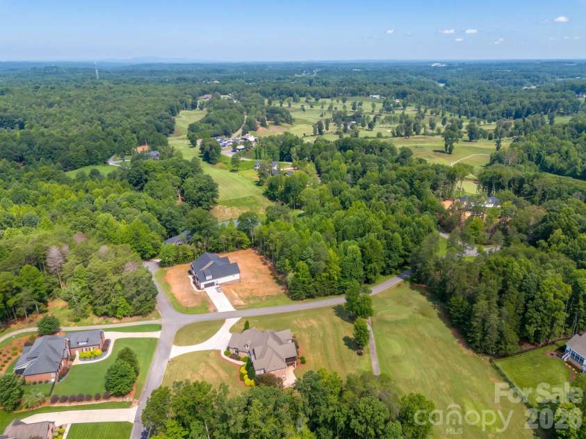 121 Cheyenne Lane, Statesville, NC 28677.  MLS# CAR4412107, YatesRealty ID 46100. Custom home overlooking the #6 teebox