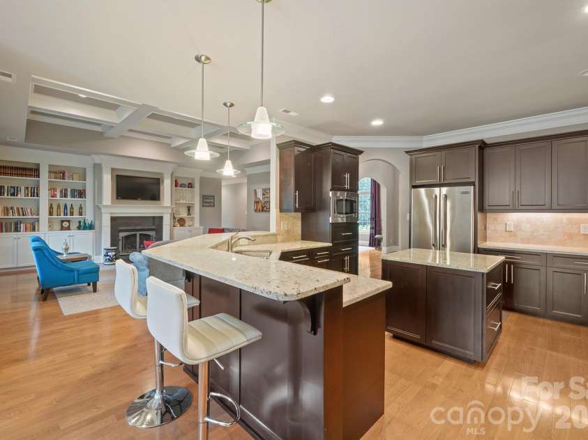 121 Cheyenne Lane, Statesville, NC 28677.  MLS# CAR4412107, YatesRealty ID 46100. Custom kitchen looking into the great room