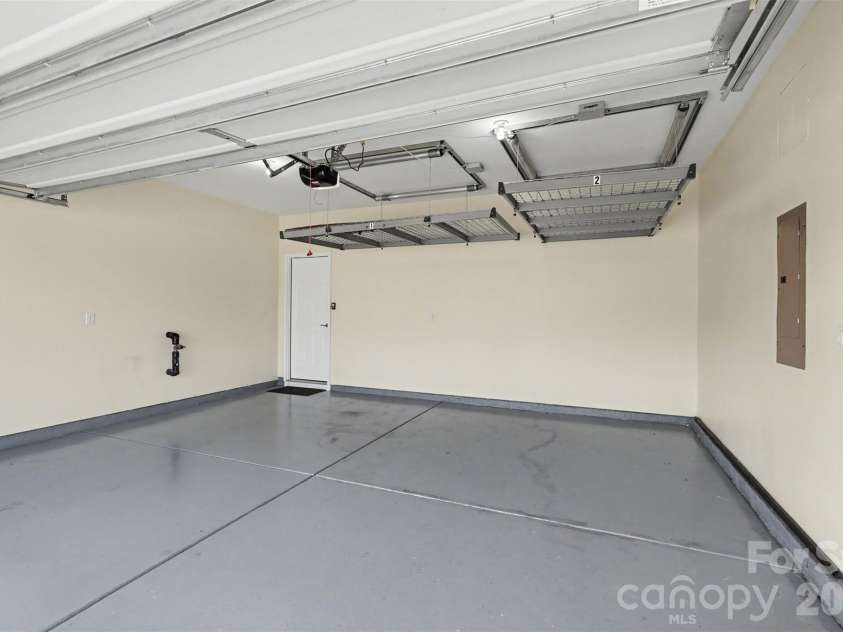 3024 Pinehills Way, Mount Holly, NC 28120.  MLS# CAR4417046, YatesRealty ID 46109. 2-Car Garage with a Motorized Ceiling Storage Lift for Additional Storage.