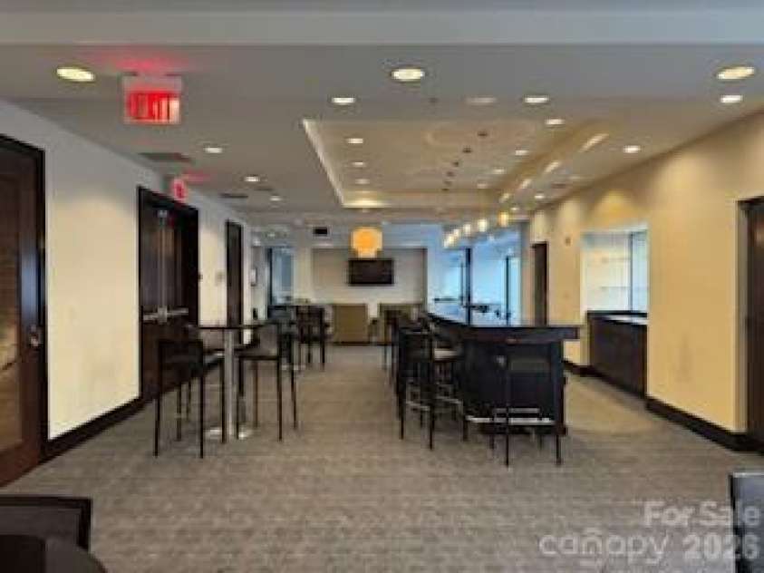 230 Tryon Street, Charlotte, NC 28202.  MLS# CAR4321048, YatesRealty ID 4611. Club House Lounge Area with Bar 
