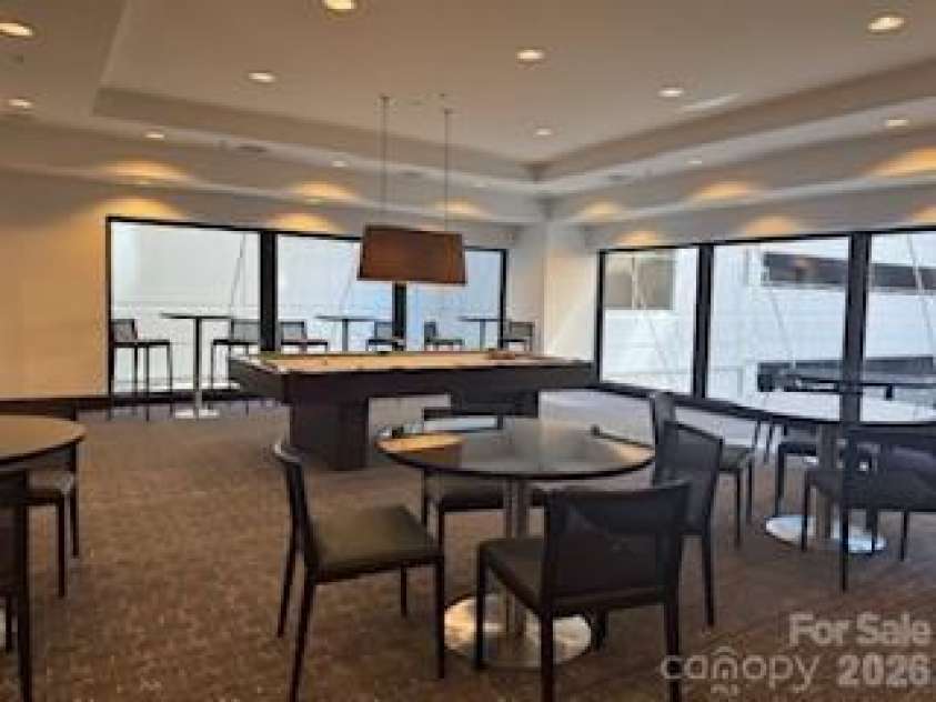 230 Tryon Street, Charlotte, NC 28202.  MLS# CAR4321048, YatesRealty ID 4611. Club House with Pool Table and View of Pool