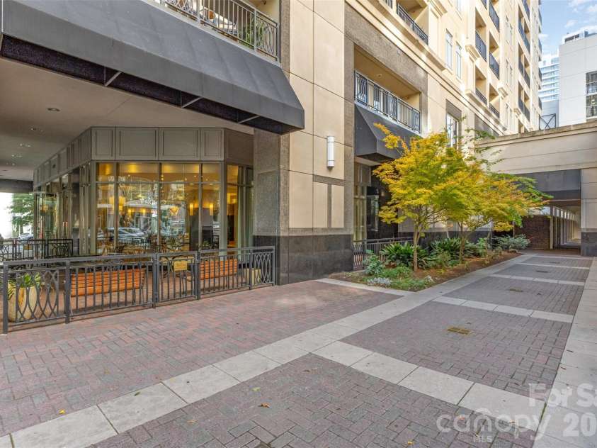 230 Tryon Street, Charlotte, NC 28202.  MLS# CAR4321048, YatesRealty ID 4611. Exterior view of condo building