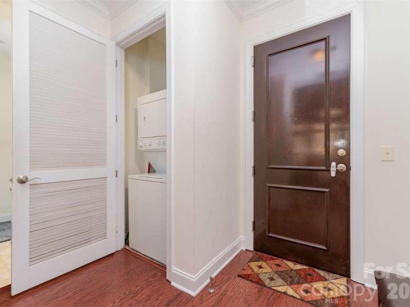 230 Tryon Street, Charlotte, NC 28202.  MLS# CAR4321048, YatesRealty ID 4611. In unit laundry closet with washer and dryer included