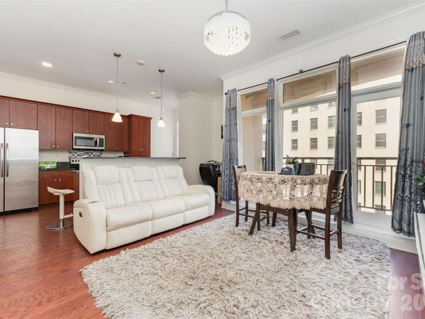 230 Tryon Street, Charlotte, NC 28202.  MLS# CAR4321048, YatesRealty ID 4611. Large windows providing beautiful city views in the main living area