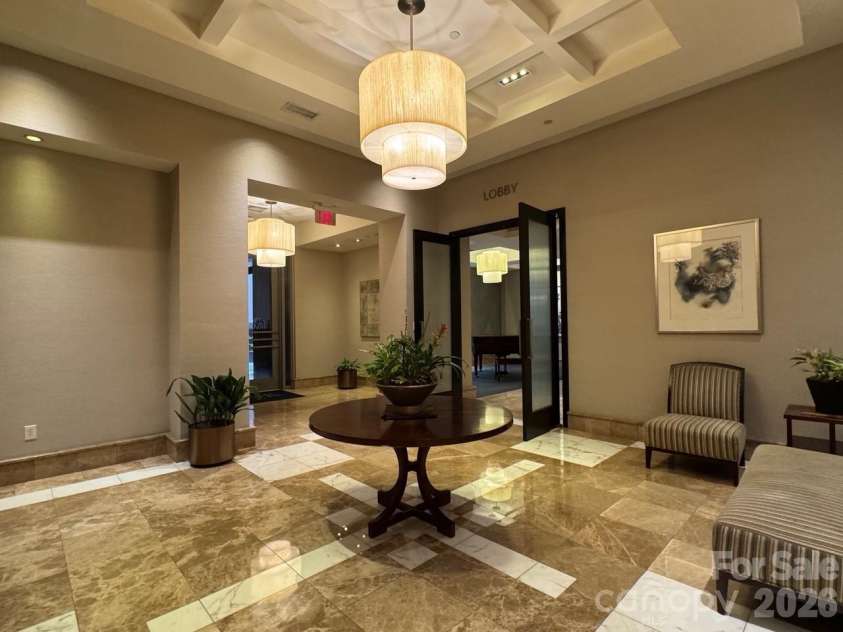 230 Tryon Street, Charlotte, NC 28202.  MLS# CAR4321048, YatesRealty ID 4611. Sitting area in Lobby