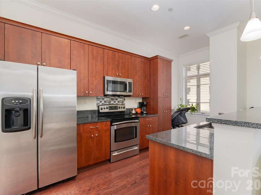 230 Tryon Street, Charlotte, NC 28202.  MLS# CAR4321048, YatesRealty ID 4611. View of Kitchen looking towards windows
