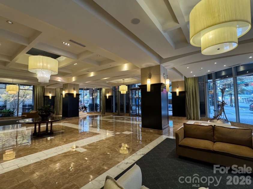230 Tryon Street, Charlotte, NC 28202.  MLS# CAR4321048, YatesRealty ID 4611. View of Lobby looking out towards S Tryon St