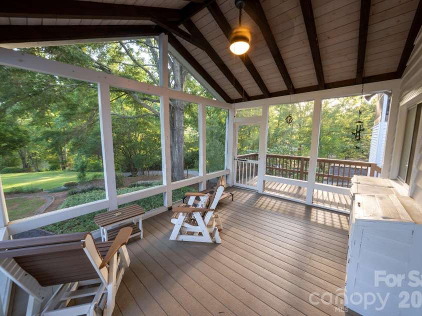 4904 Willow Pond Road, Clover, SC 29710.  MLS# CAR4412083, YatesRealty ID 46114. Back screened porch overlooking back yard and pond