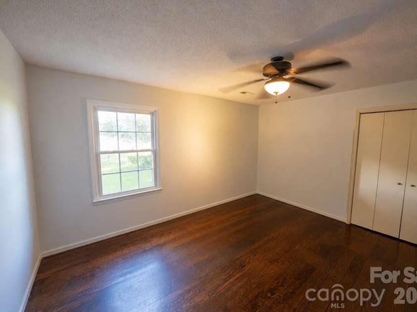 4904 Willow Pond Road, Clover, SC 29710.  MLS# CAR4412083, YatesRealty ID 46114. Second floor guest bedroom with wall closet and ceiling fan