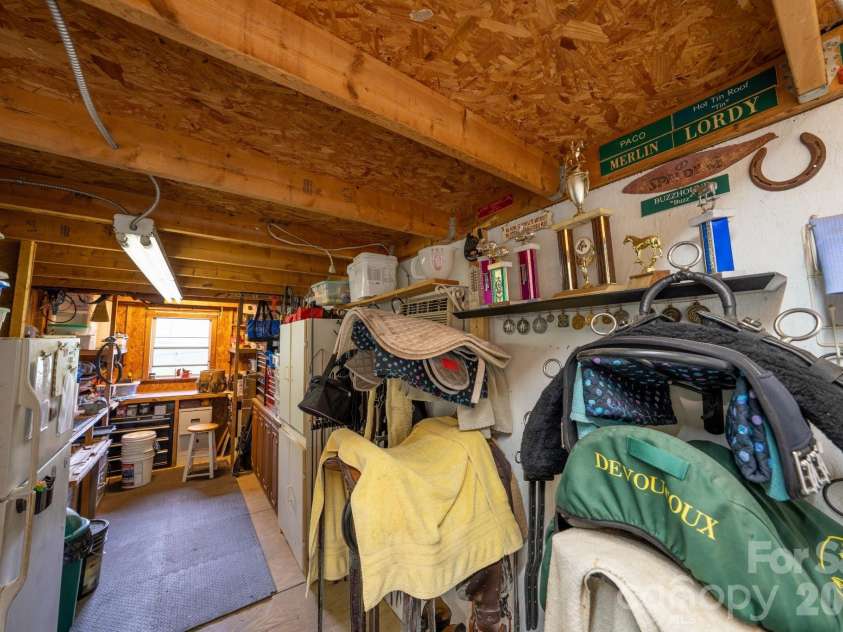 4904 Willow Pond Road, Clover, SC 29710.  MLS# CAR4412083, YatesRealty ID 46114. Tack room has workshop area and refrigerator