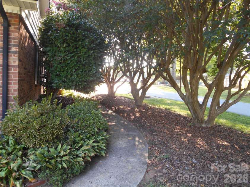 830 Salem Church Road, Lincolnton, NC 28092.  MLS# CAR4416779, YatesRealty ID 46118. Side Walkway Lined with Crepe Myrtle Trees