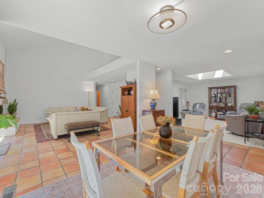 5 Jackson Grove, Landrum, SC 29356.  MLS# CAR4416972, YatesRealty ID 46122. Dining area looking into Great Room on the left and Den on the right.