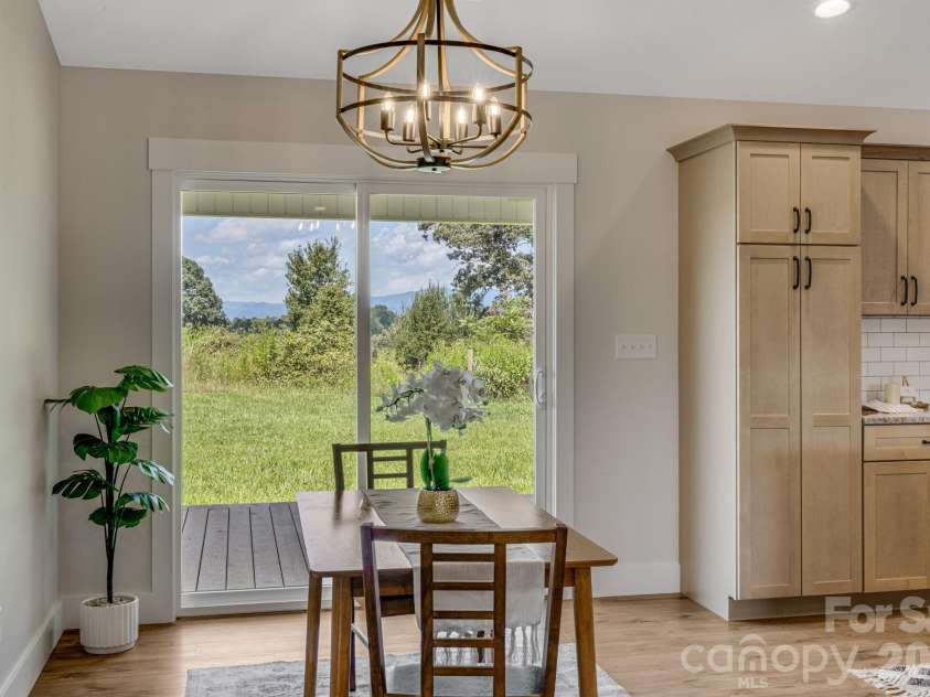 735 Jupiter Road, Weaverville, NC 28787.  MLS# CAR4410914, YatesRealty ID 46131. Dining Area open to Back Deck