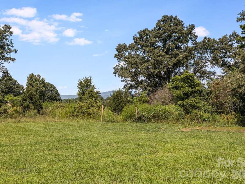 735 Jupiter Road, Weaverville, NC 28787.  MLS# CAR4410914, YatesRealty ID 46131. Flat Back Yard