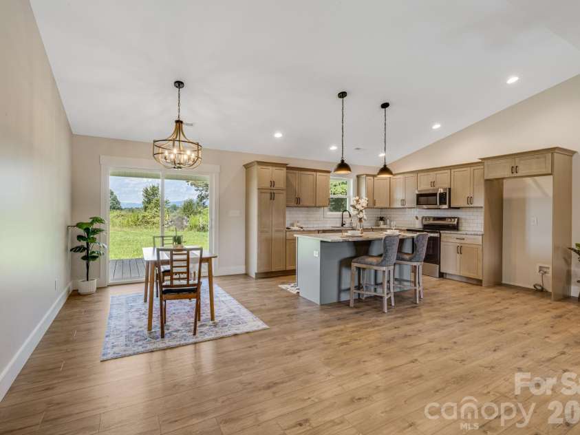 735 Jupiter Road, Weaverville, NC 28787.  MLS# CAR4410914, YatesRealty ID 46131. Kitchen and Dining Area