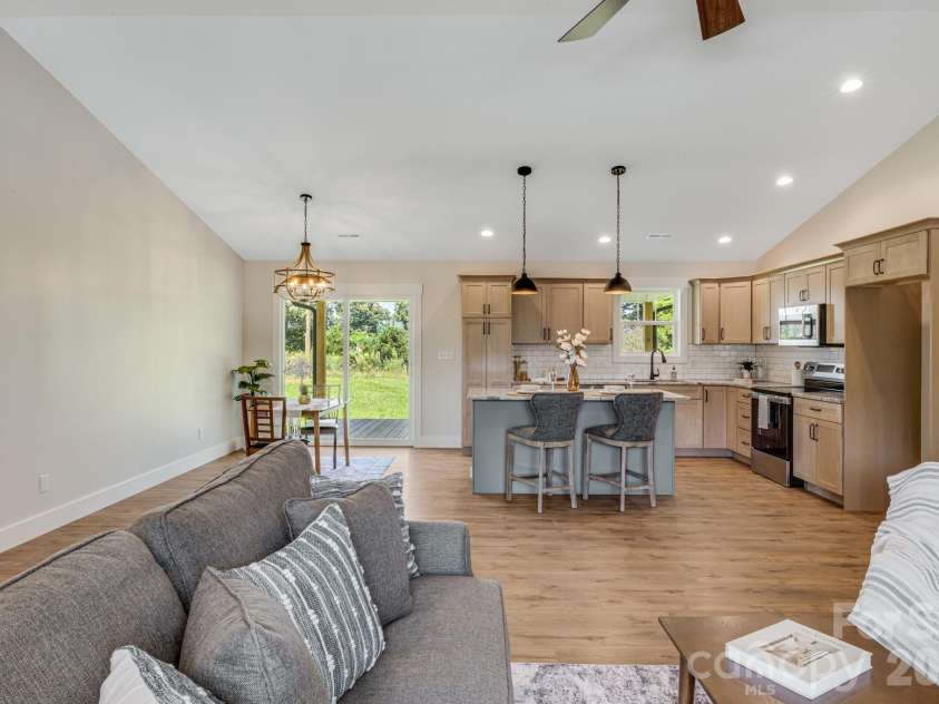 735 Jupiter Road, Weaverville, NC 28787.  MLS# CAR4410914, YatesRealty ID 46131. Living Room looking toward Kitchen