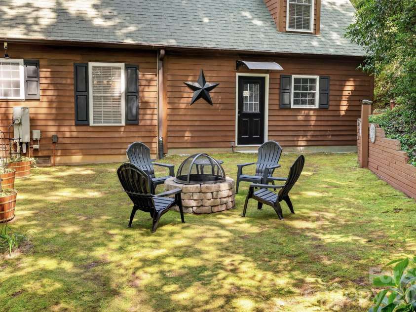 130 Cherokee Circle, Lake Toxaway, NC 28747.  MLS# CAR4415976, YatesRealty ID 46134. Back yard firepit.
