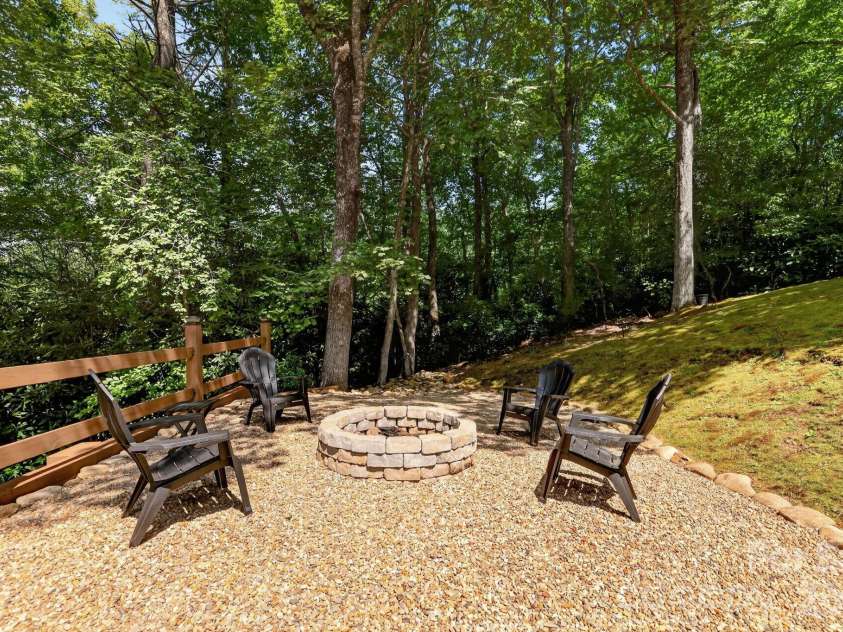 130 Cherokee Circle, Lake Toxaway, NC 28747.  MLS# CAR4415976, YatesRealty ID 46134. Front yard firepit area.