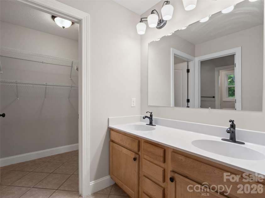 11 Tahchee Trail, Fletcher, NC 28732.  MLS# CAR4415640, YatesRealty ID 46135. Dual Vanity in Primary En Suite