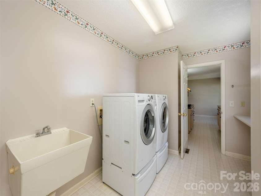15 Glen Crest Drive, Arden, NC 28704.  MLS# CAR4416673, YatesRealty ID 46138. Laundry Room off the Kitchen
