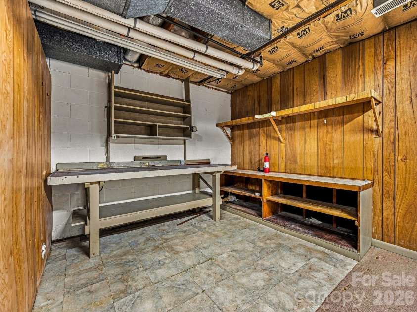175 Robinhood Road, Asheville, NC 28804.  MLS# CAR4416843, YatesRealty ID 46146. Workshop in Basement