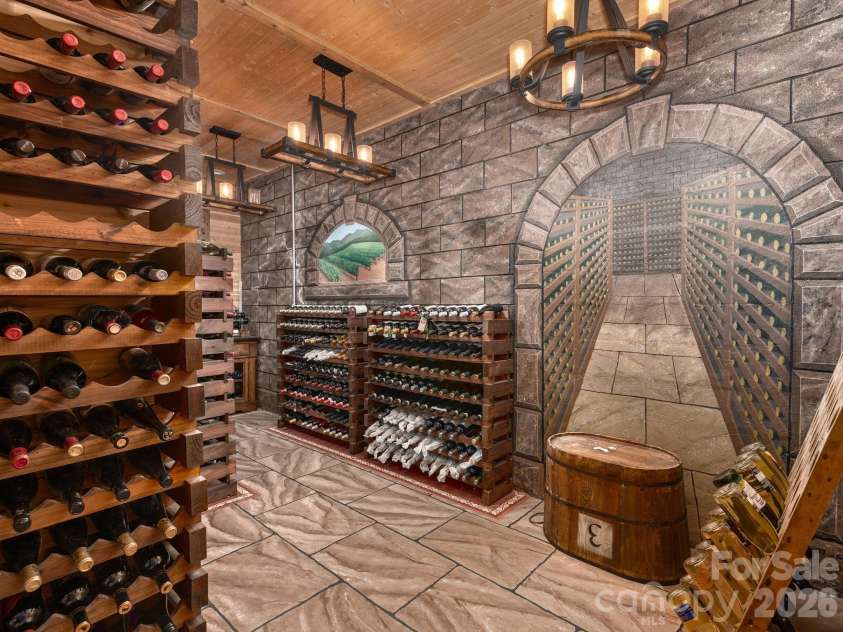 135 Potato Branch Road, Leicester, NC 28748.  MLS# CAR4415427, YatesRealty ID 46150. Wine Cellar