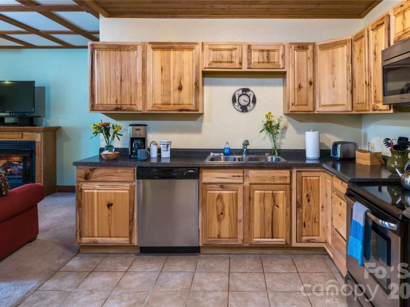135 Potato Branch Road, Leicester, NC 28748.  MLS# CAR4415427, YatesRealty ID 46150. Wineberry Cabin Kitchen