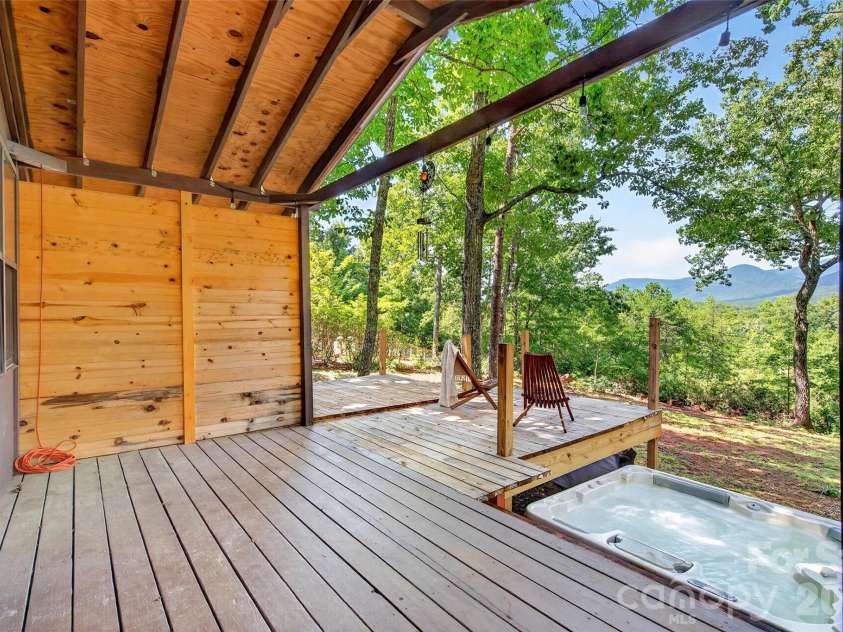128 Pearson Circle, Lake Lure, NC 28746.  MLS# CAR4417256, YatesRealty ID 46151. Covered back deck