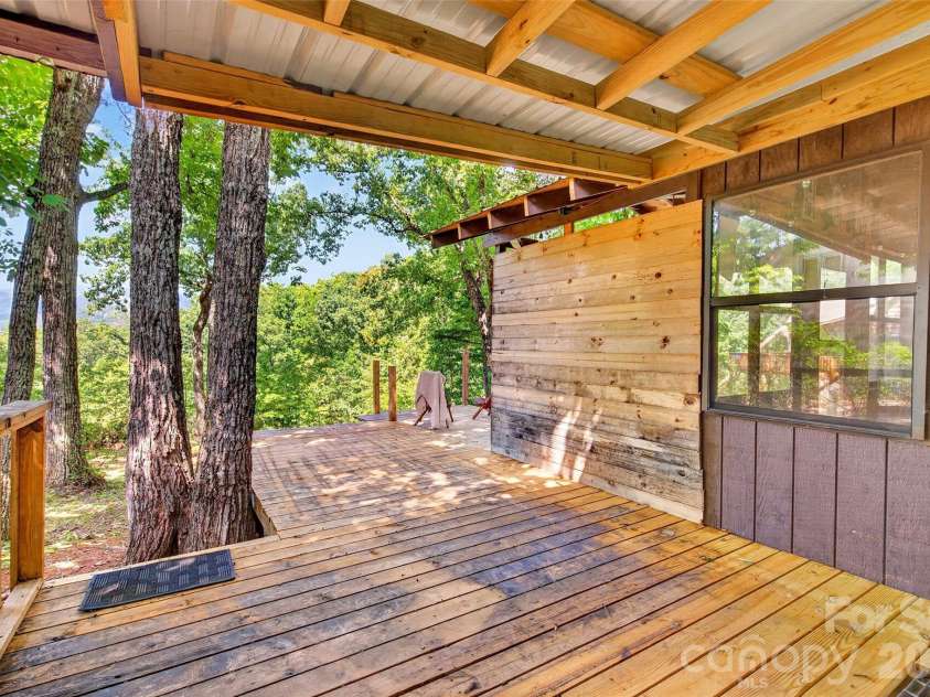 128 Pearson Circle, Lake Lure, NC 28746.  MLS# CAR4417256, YatesRealty ID 46151. Covered back deck