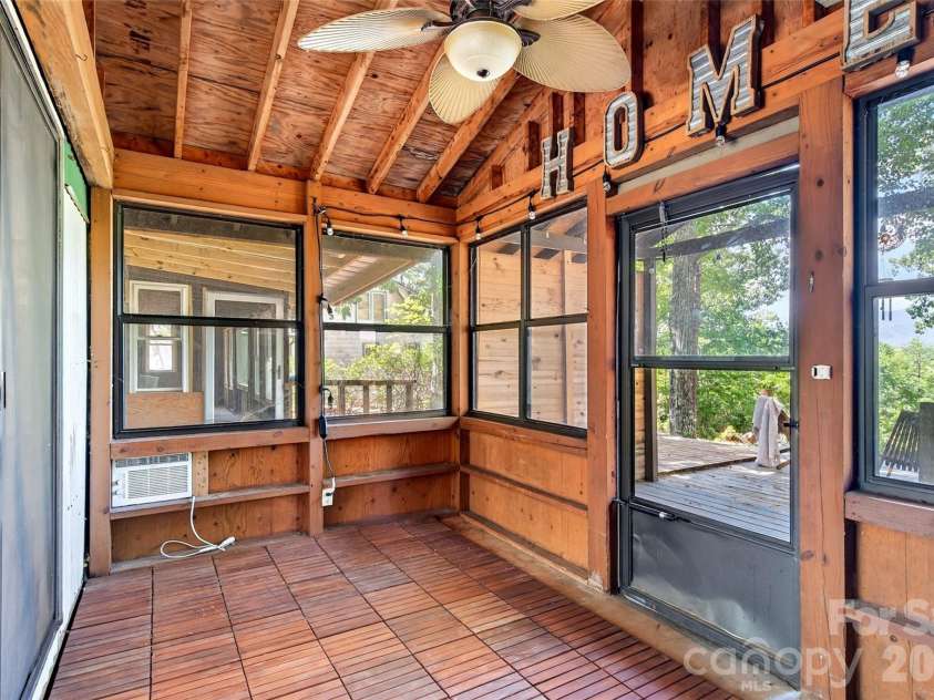 128 Pearson Circle, Lake Lure, NC 28746.  MLS# CAR4417256, YatesRealty ID 46151. Enclosed back porch