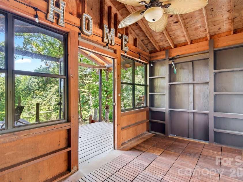 128 Pearson Circle, Lake Lure, NC 28746.  MLS# CAR4417256, YatesRealty ID 46151. Enclosed back porch