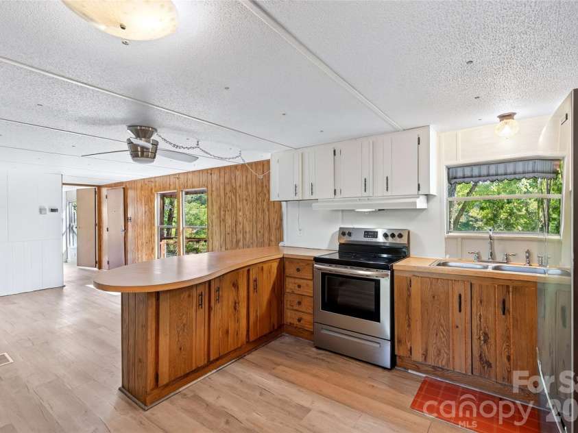 128 Pearson Circle, Lake Lure, NC 28746.  MLS# CAR4417256, YatesRealty ID 46151. Functional kitchen