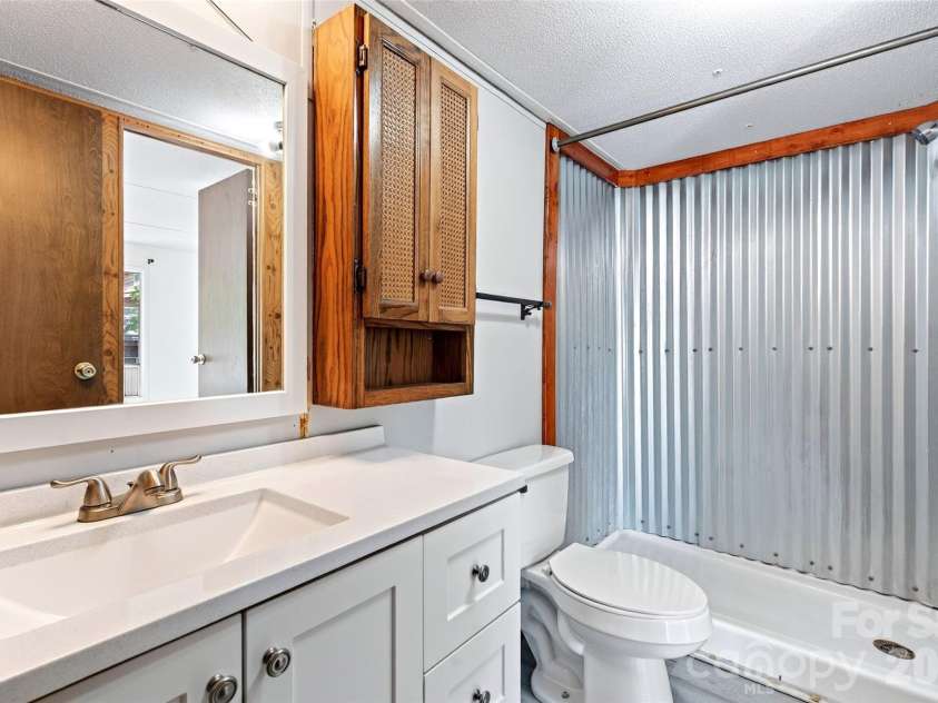 128 Pearson Circle, Lake Lure, NC 28746.  MLS# CAR4417256, YatesRealty ID 46151. Guest bath