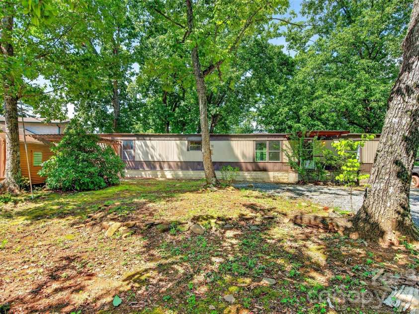 128 Pearson Circle, Lake Lure, NC 28746.  MLS# CAR4417256, YatesRealty ID 46151. Level front yard