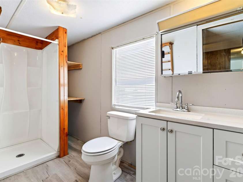 128 Pearson Circle, Lake Lure, NC 28746.  MLS# CAR4417256, YatesRealty ID 46151. Primary bath