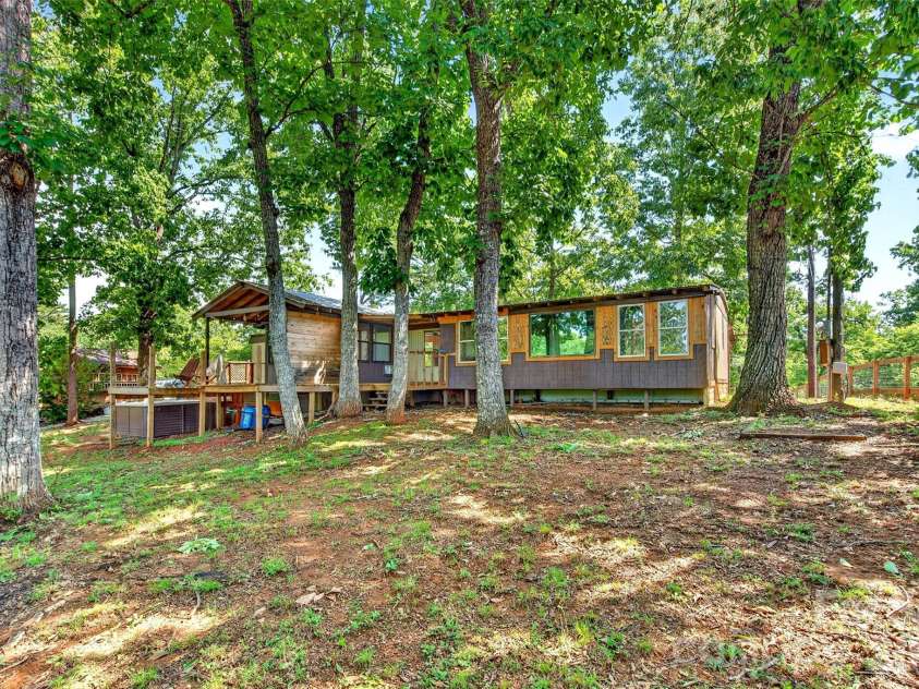 128 Pearson Circle, Lake Lure, NC 28746.  MLS# CAR4417256, YatesRealty ID 46151. Rear of home