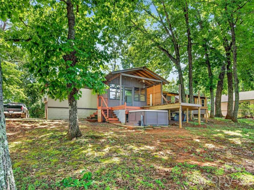 128 Pearson Circle, Lake Lure, NC 28746.  MLS# CAR4417256, YatesRealty ID 46151. Rear of home
