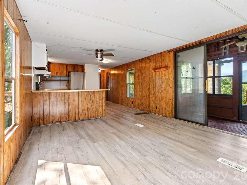 128 Pearson Circle, Lake Lure, NC 28746.  MLS# CAR4417256, YatesRealty ID 46151. Walk in to the open living dining and kitchen.