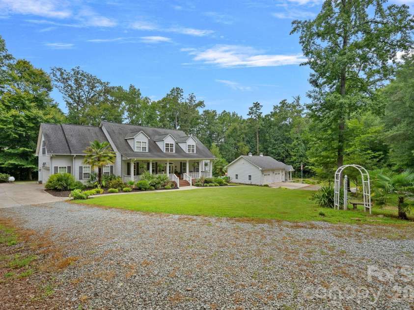 3850 Oakdale Road, Charlotte, NC 28216.  MLS# CAR4417227, YatesRealty ID 46158. 2-car side load and 2-car detached garages.