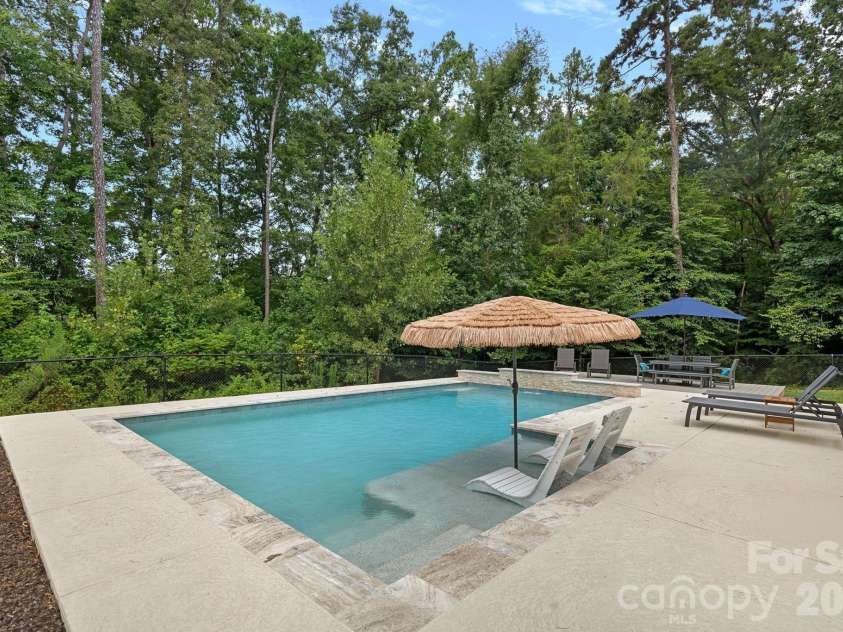 3850 Oakdale Road, Charlotte, NC 28216.  MLS# CAR4417227, YatesRealty ID 46158. Heated, salt-water, pebbletech pool.