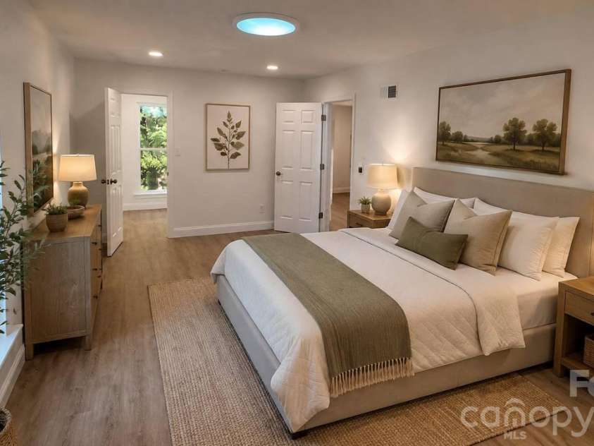 7107 Stonington Lane, Charlotte, NC 28227.  MLS# CAR4416930, YatesRealty ID 46171. AI staged master bedroom