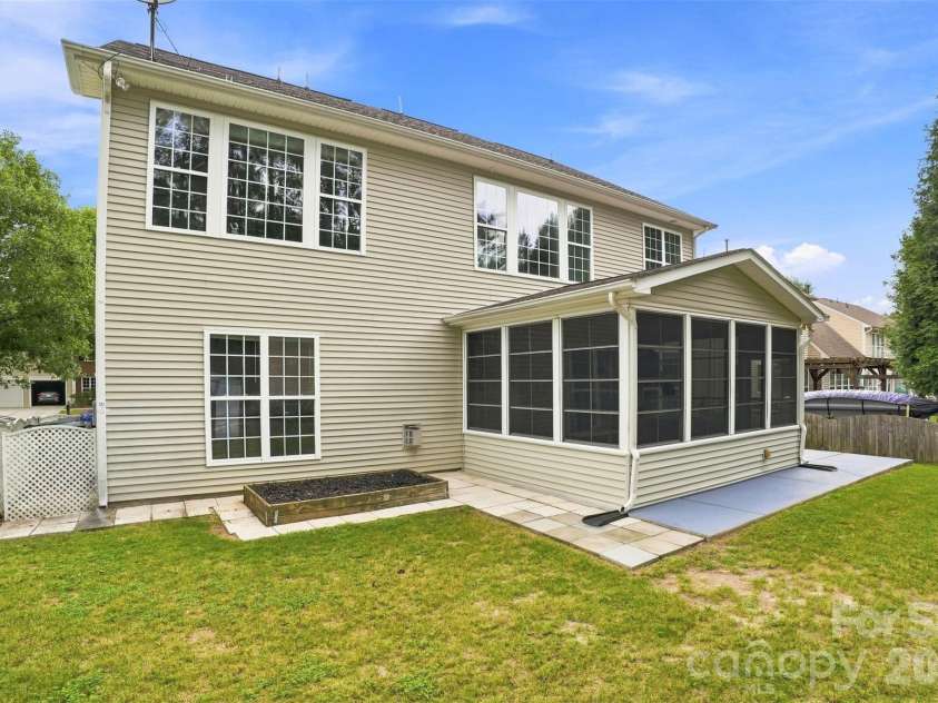 10345 Scotland Avenue, Indian Land, SC 29707.  MLS# CAR4416567, YatesRealty ID 46181. Low-maintenance exterior siding helps simplify upkeep, while the raised garden box is ready for seasonal vegetables, herbs, or flowers