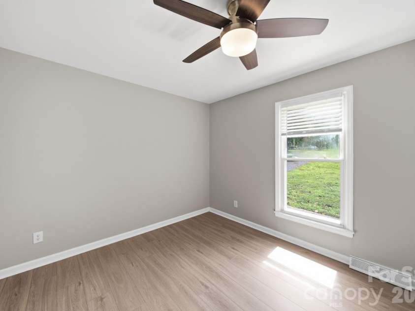 4710 Carving Tree Drive, Charlotte, NC 28227.  MLS# CAR4416653, YatesRealty ID 46194. 4th bedroom off the kitchen and living area that could also function as a flex room: could be a formal dining room, office, or anything else you like!