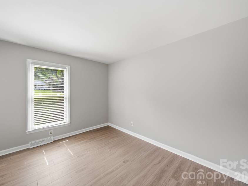 4710 Carving Tree Drive, Charlotte, NC 28227.  MLS# CAR4416653, YatesRealty ID 46194. 4th bedroom off the kitchen and living area that could also function as a flex room: could be a formal dining room, office, or anything else you like!