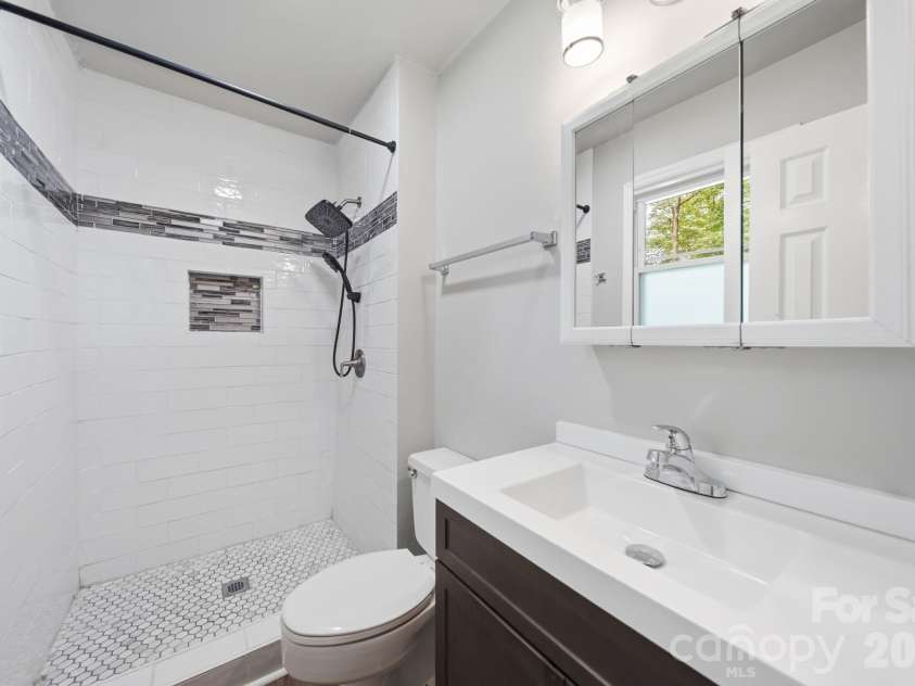 4710 Carving Tree Drive, Charlotte, NC 28227.  MLS# CAR4416653, YatesRealty ID 46194. Fully updated primary bathroom