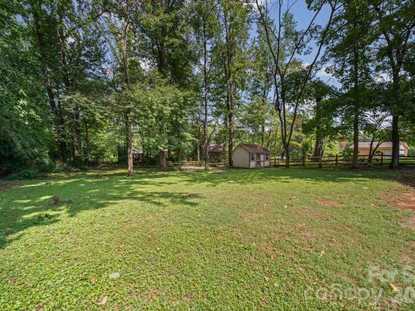 4710 Carving Tree Drive, Charlotte, NC 28227.  MLS# CAR4416653, YatesRealty ID 46194. Huge, green, private backyard with a shed