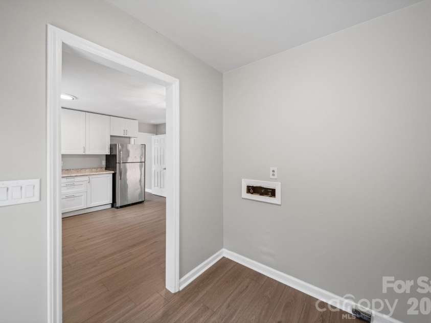 4710 Carving Tree Drive, Charlotte, NC 28227.  MLS# CAR4416653, YatesRealty ID 46194. Laundry room off the kitchen