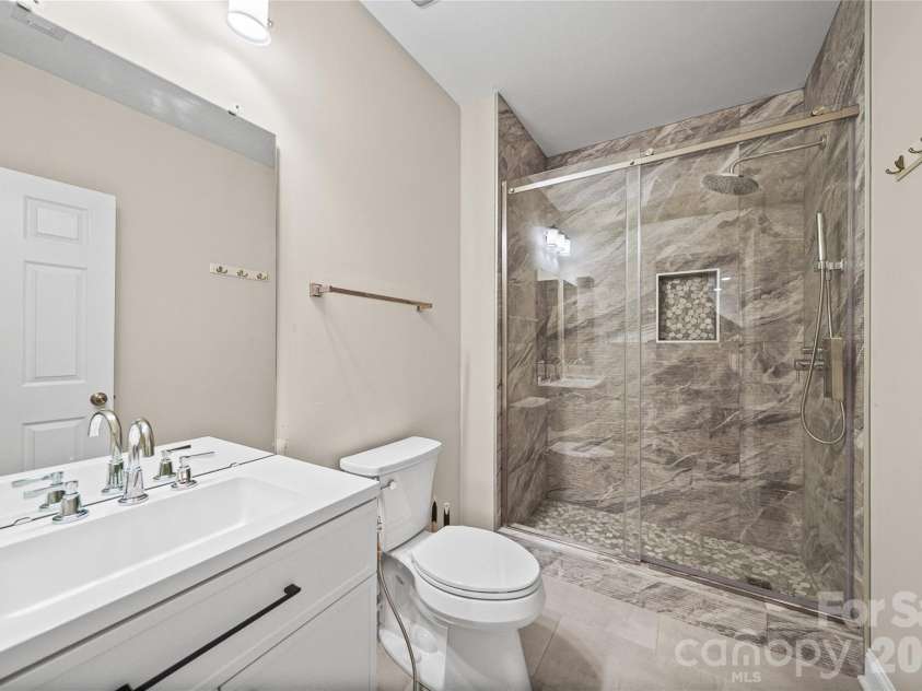 2246 Donnington Lane, Concord, NC 28027.  MLS# CAR4415770, YatesRealty ID 46197. Basement full bathroom