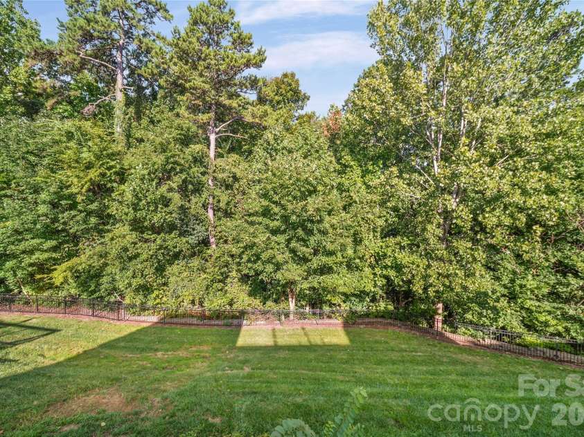 2246 Donnington Lane, Concord, NC 28027.  MLS# CAR4415770, YatesRealty ID 46197. Private wooded backyard