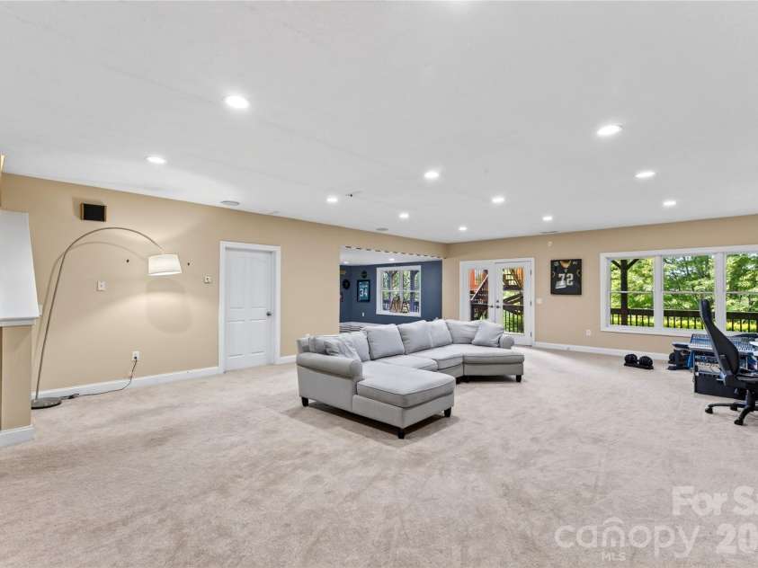 719 April Park, Waynesville, NC 28786.  MLS# CAR4414470, YatesRealty ID 46204. Lower Level Intertaining Room